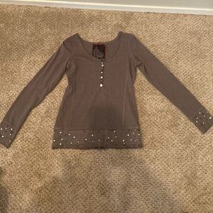 Long sleeve studded shirt.